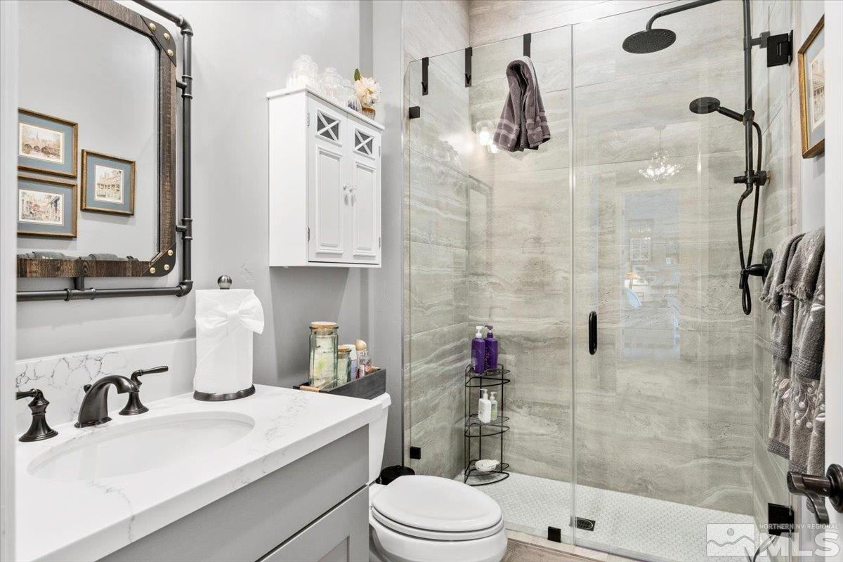 2166 Kate's Bridge Drive Reno, NV 89521 - Photo 20 of 34 a bathroom with a sink toilet and shower