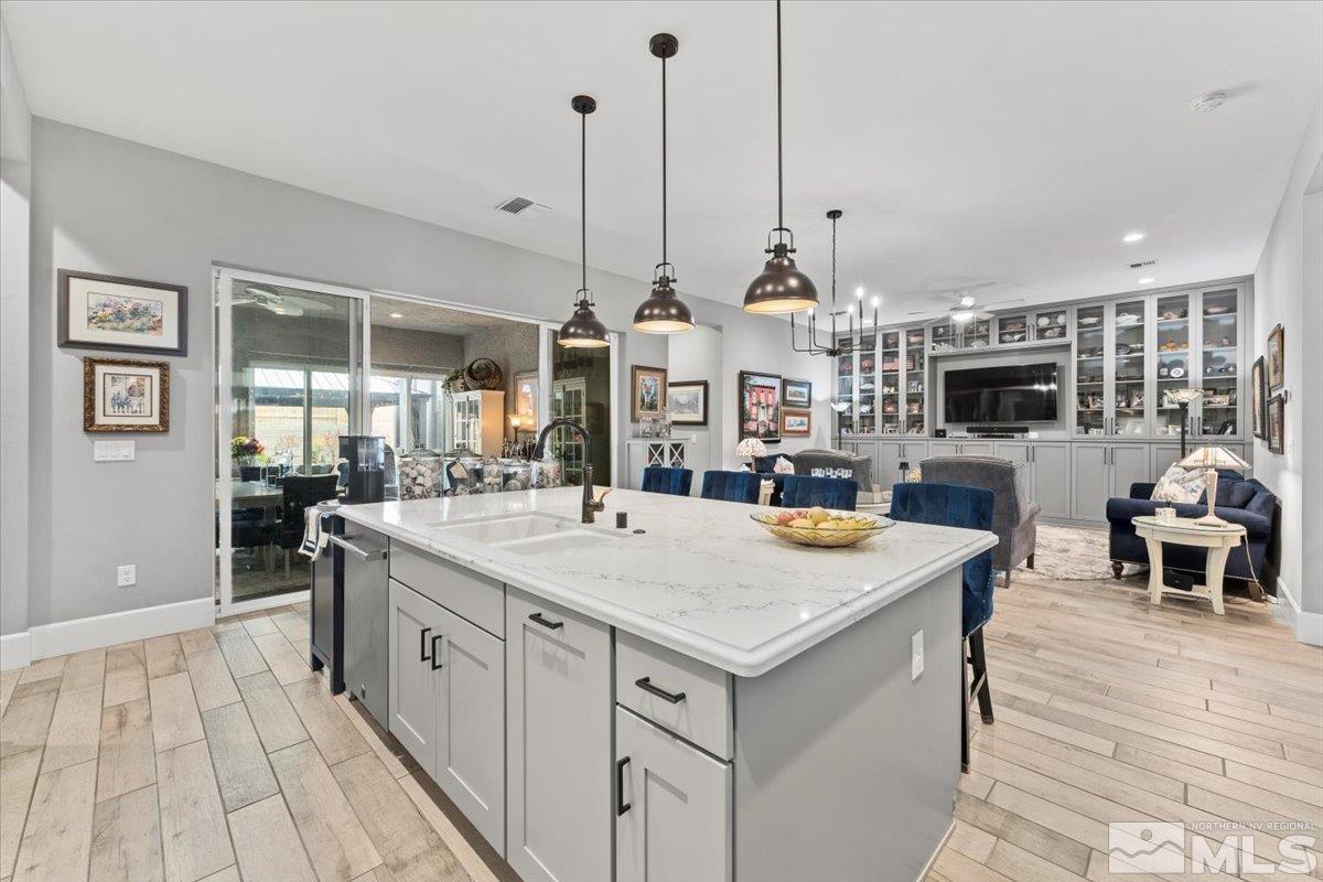2166 Kate's Bridge Drive Reno, NV 89521 - Photo 2 of 34 a large kitchen with kitchen island a large island in it