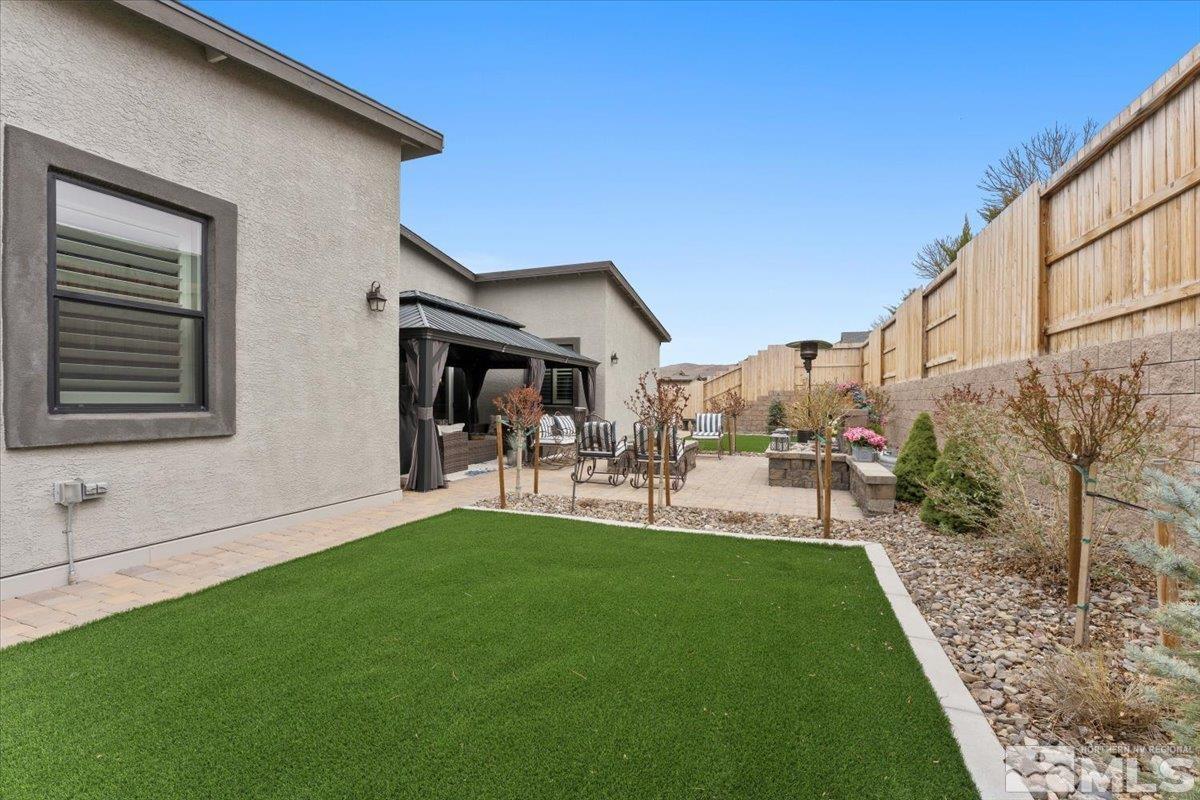 2166 Kate's Bridge Drive Reno, NV 89521 - Photo 28 of 34 a view of house with backyard porch and sitting area