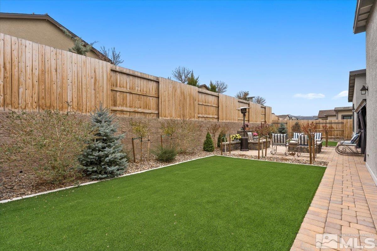 2166 Kate's Bridge Drive Reno, NV 89521 - Photo 29 of 34 a view of a backyard with sitting area
