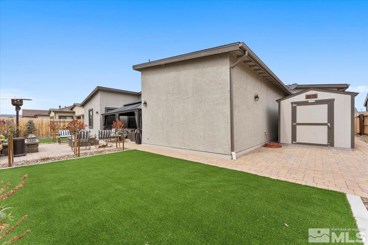 2166 Kate's Bridge Drive Reno, NV 89521 - Photo 30 of 34 a view of a backyard with a garden and plants