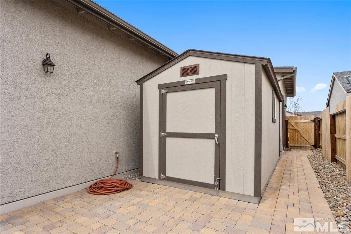 2166 Kate's Bridge Drive Reno, NV 89521 - Photo 31 of 34 a view of a room with a door and wooden floor