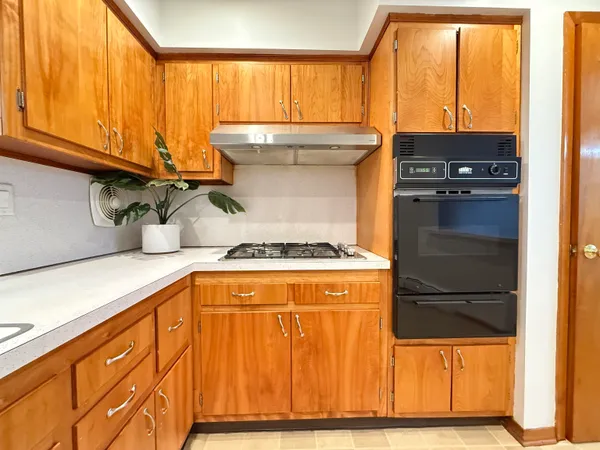 a kitchen with a window a sink and a refrigerator