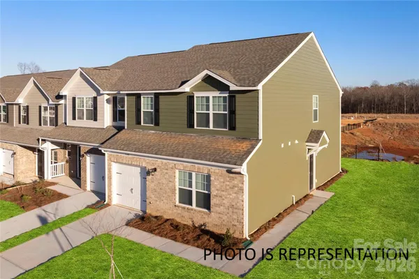 a aerial view of a house with a yard