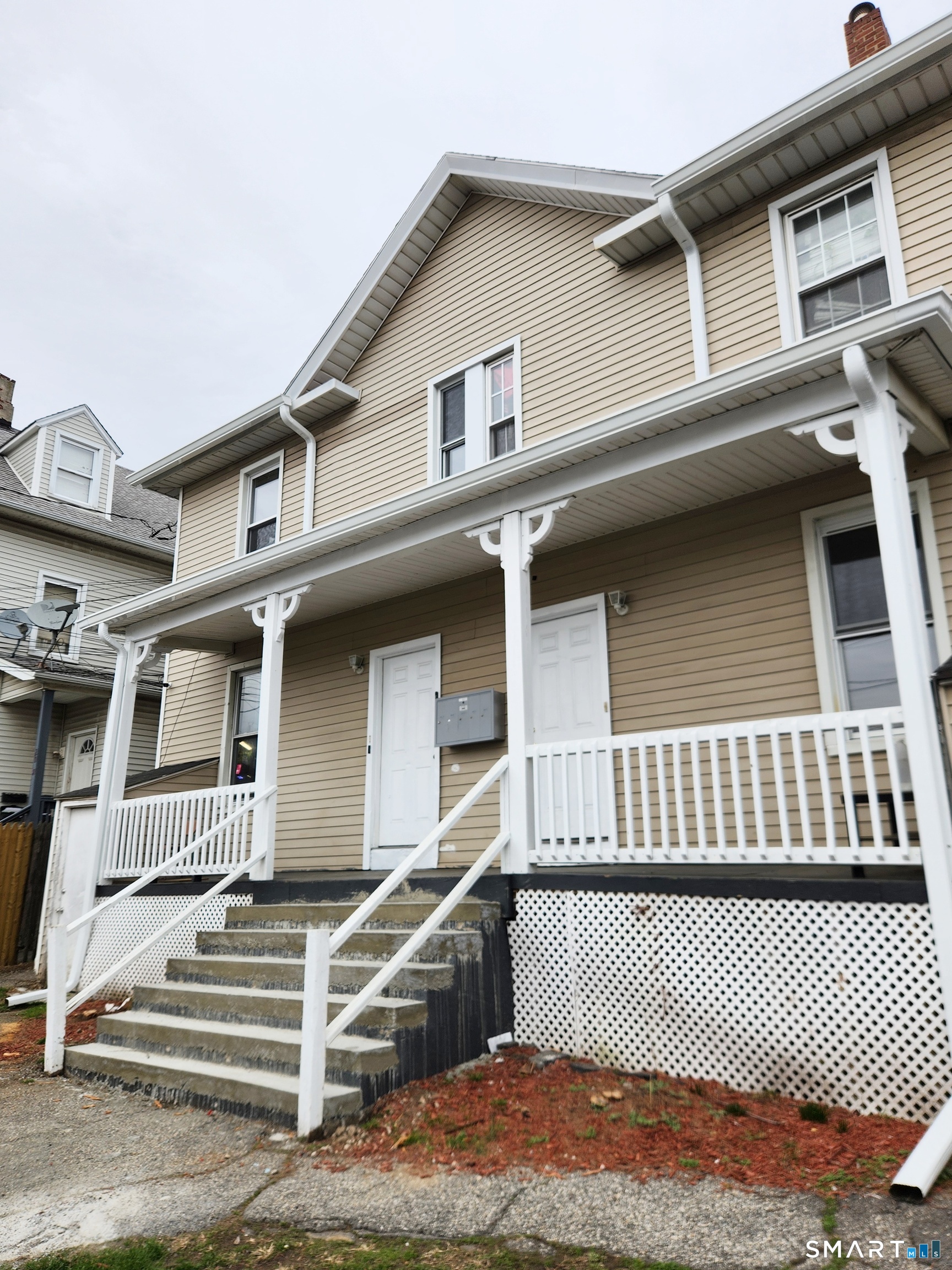 202 Harral Avenue, Unit B Bridgeport, CT 06604 - Photo 1 of 11 a front view of a house with garage