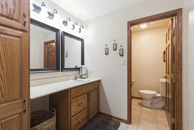 a kitchen with stainless steel appliances kitchen island granite countertop a sink stove and cabinets