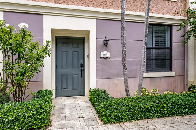 a front view of a house with a garage