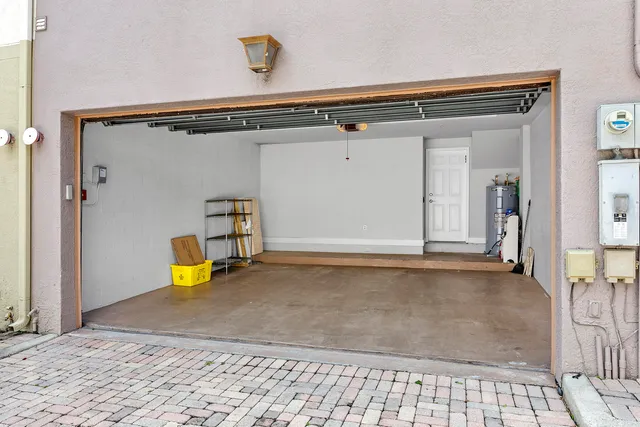 a view of a bathtub in a hall with wooden floor