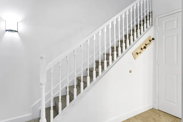 a view of staircase with white walls and white walls