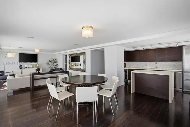 a bedroom with a bed wooden floor and lamp