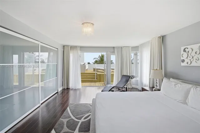 a bathroom with a shower and a glass door