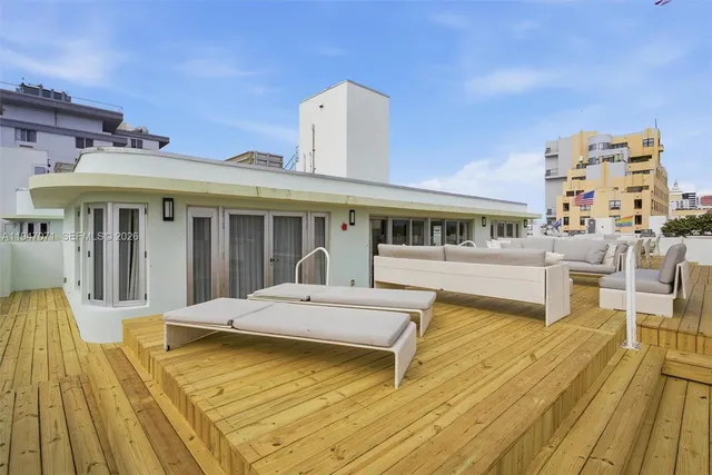 an aerial view of a city with ocean