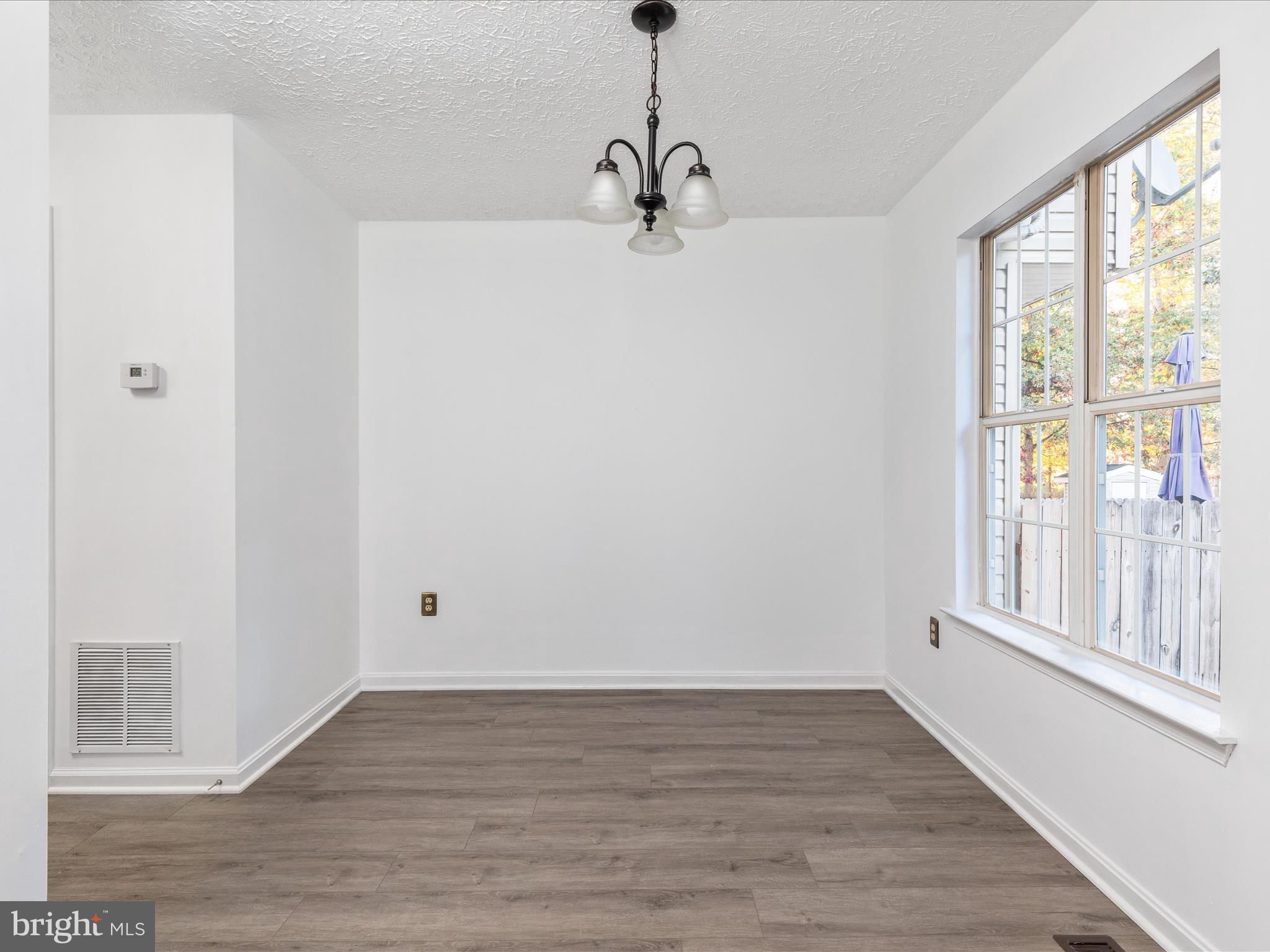 321 Sherando Circle Stephens City, VA 22655 - Photo 11 of 34 a view of empty room with wooden floor and fan