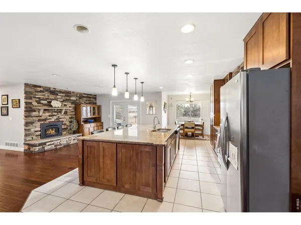 a kitchen with stainless steel appliances kitchen island granite countertop lots of counter top space and furniture