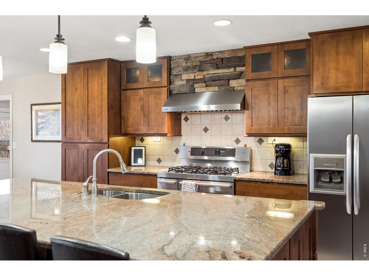 3000 Marion Street Fort Collins, CO 80521 - Photo 13 of 50 a kitchen with stainless steel appliances granite countertop a sink refrigerator and microwave