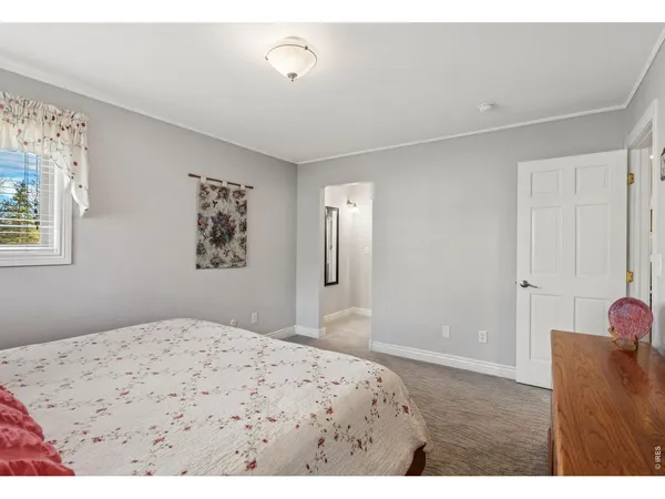 a bedroom with a bed and a cabinets