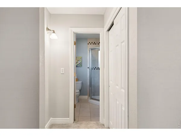 a view of a bathroom from a hallway