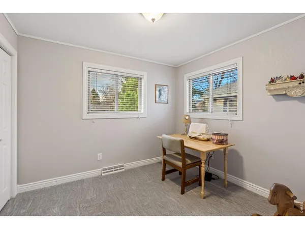 a workspace with furniture and a window