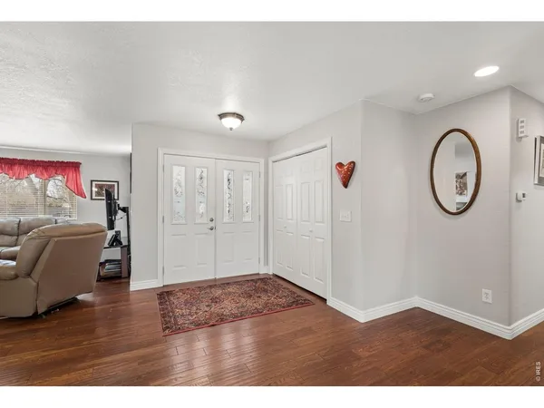 a view of a livingroom with wooden floor