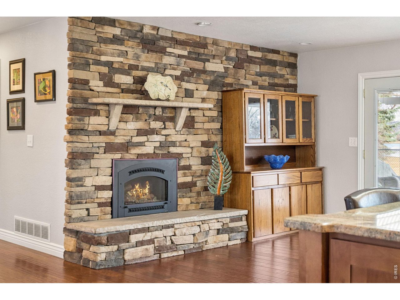 3000 Marion Street Fort Collins, CO 80521 - Photo 7 of 50 a kitchen with a wooden floor and a fireplace