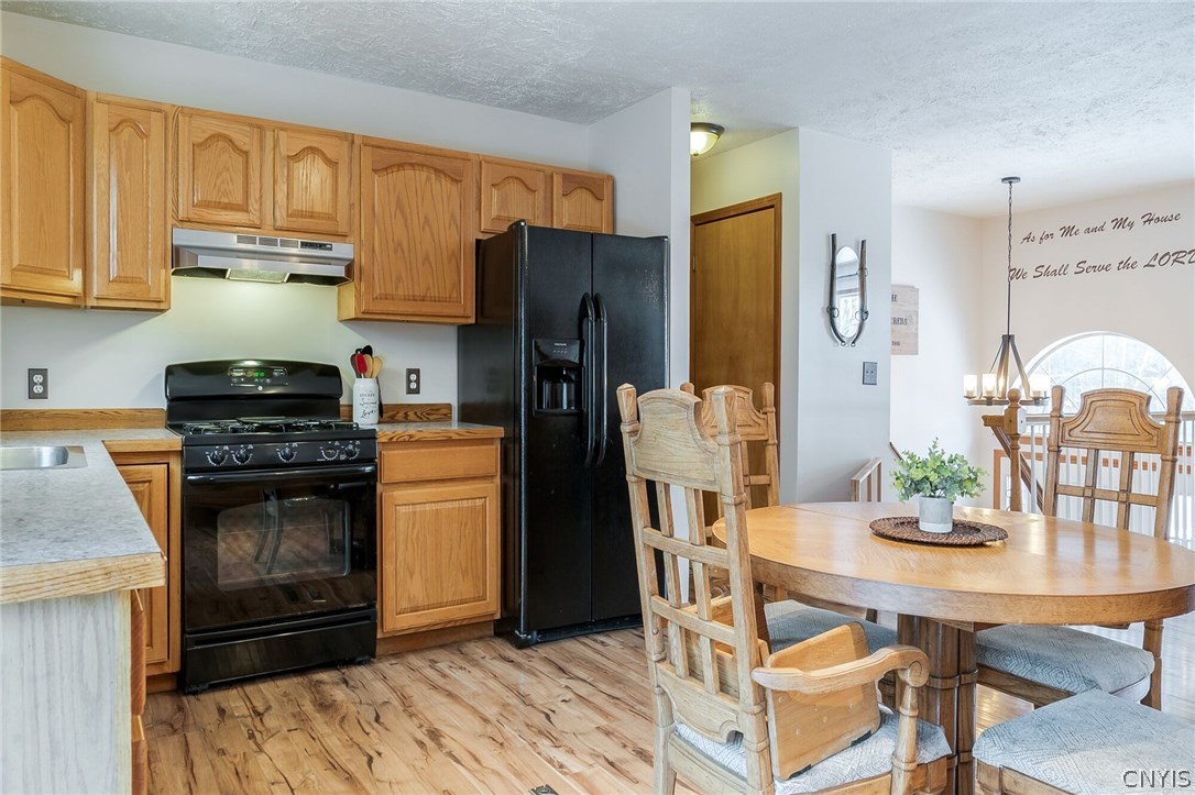 291 Dutch Hill Road Parish, NY 13167 - Photo 15 of 34 Another view of kitchen showing open hallway to th