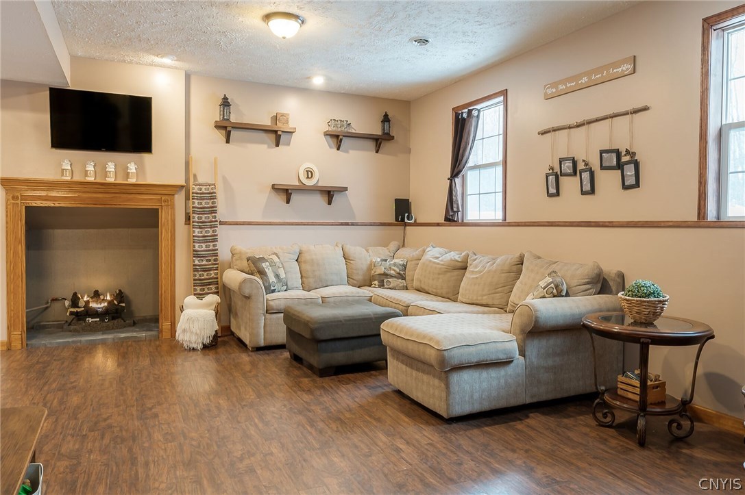 291 Dutch Hill Road Parish, NY 13167 - Photo 23 of 34 Lots of space and natural light with cozy gas fire