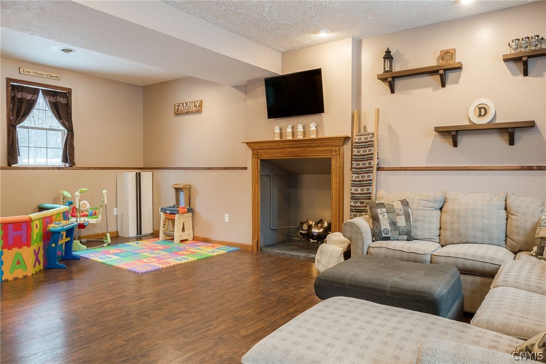 291 Dutch Hill Road Parish, NY 13167 - Photo 24 of 34 Another angle of the downstairs family room showin