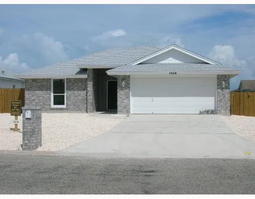 a front view of a house with a garage