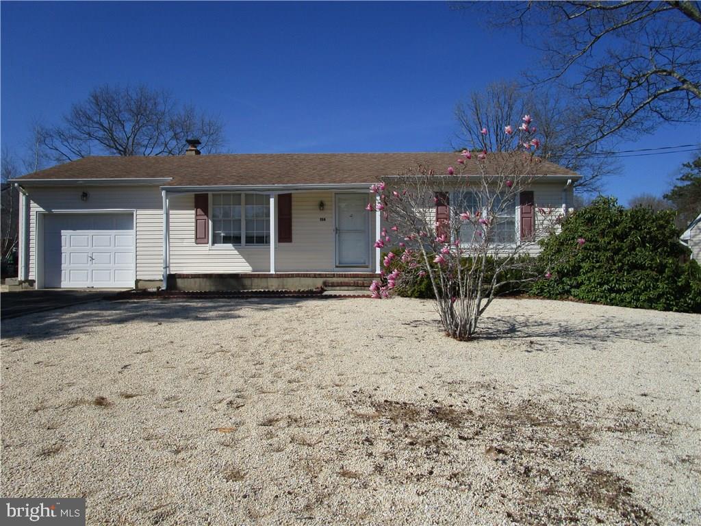 156 Dolphin Road Manahawkin, NJ 08050 - Photo 1 of 9 a front view of a house with a yard