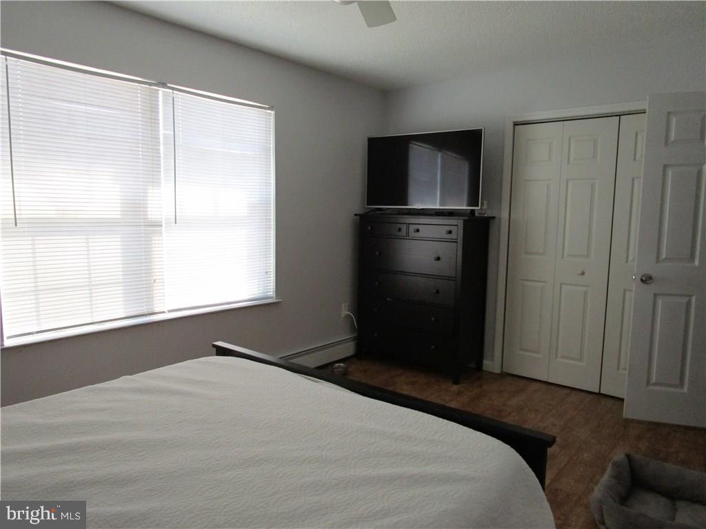156 Dolphin Road Manahawkin, NJ 08050 - Photo 8 of 9 a bedroom with a bed and a window