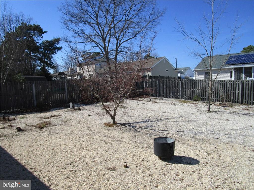 156 Dolphin Road Manahawkin, NJ 08050 - Photo 9 of 9 a view of a yard covered in snow