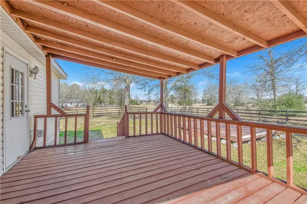 a view of a balcony with wooden floor