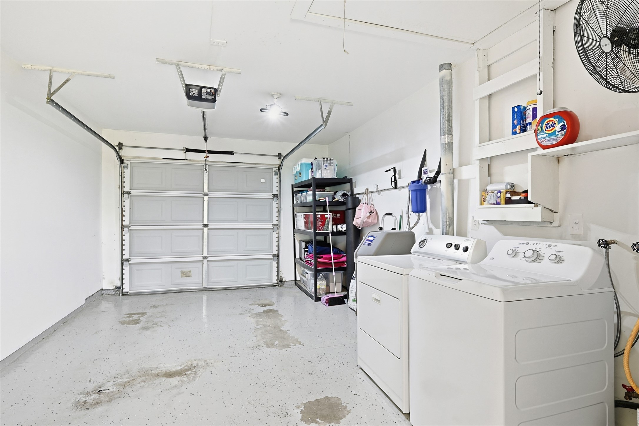 2015 Woodcrest Drive Houston, TX 77018 - Photo 20 of 30 This photo shows the organized garage with laundry area.