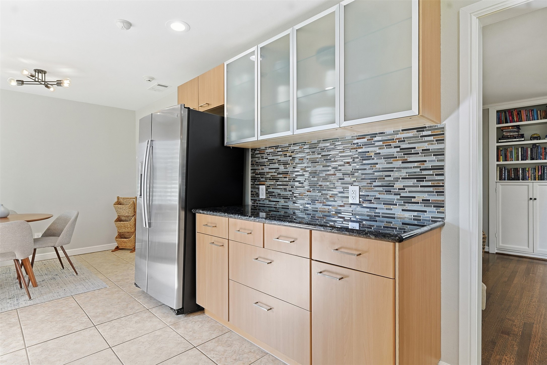 2015 Woodcrest Drive Houston, TX 77018 - Photo 9 of 30 This updated kitchen features modern cabinets and tile backsplash.