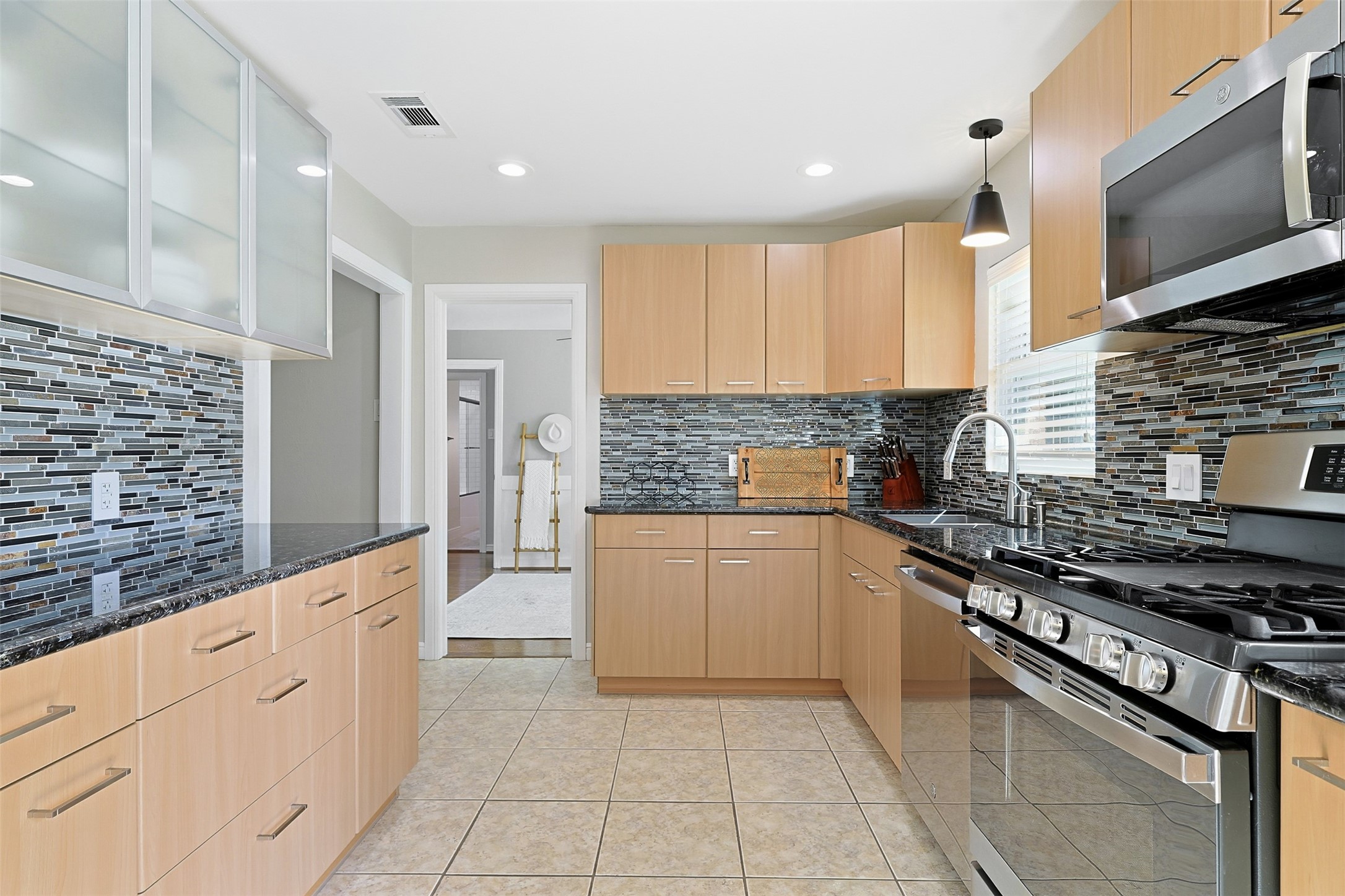 2015 Woodcrest Drive Houston, TX 77018 - Photo 10 of 30 All kitchen appliances were replaced in 2022 with GE stainless steel appliances.