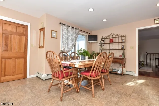 a view of a glass door with a chair