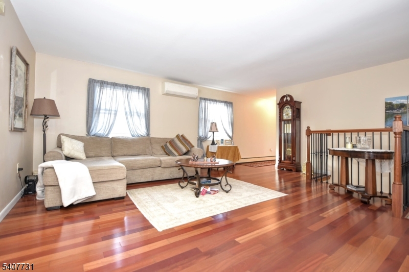 7 Birch Road Bloomingdale, NJ 07403 - Photo 16 of 45 a living room with furniture a window and a wooden floor