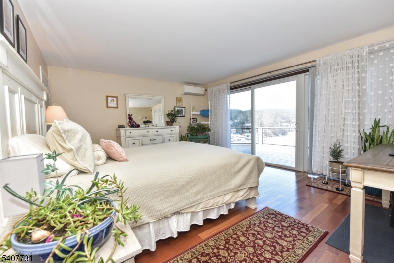 7 Birch Road Bloomingdale, NJ 07403 - Photo 21 of 45 a bed sitting in a bedroom next to a window