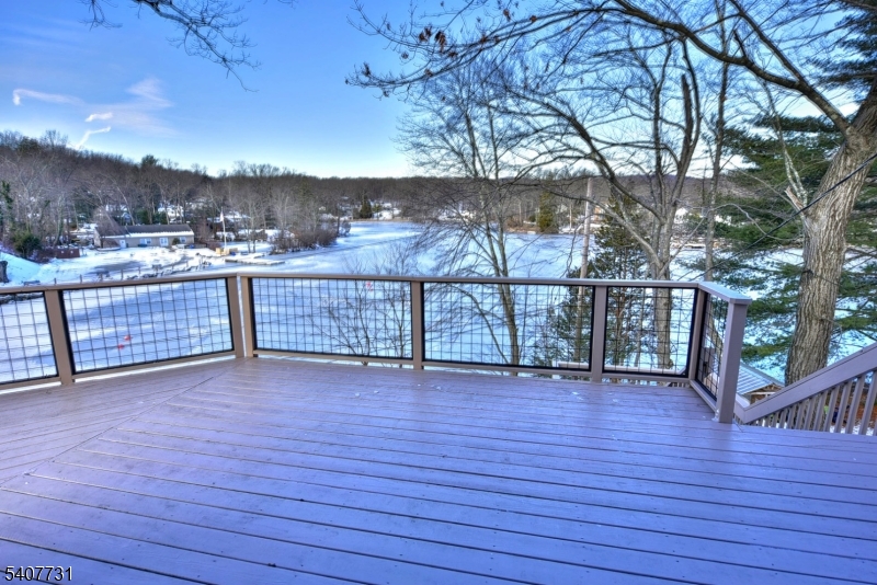7 Birch Road Bloomingdale, NJ 07403 - Photo 28 of 45 an empty room with wooden floor and large trees