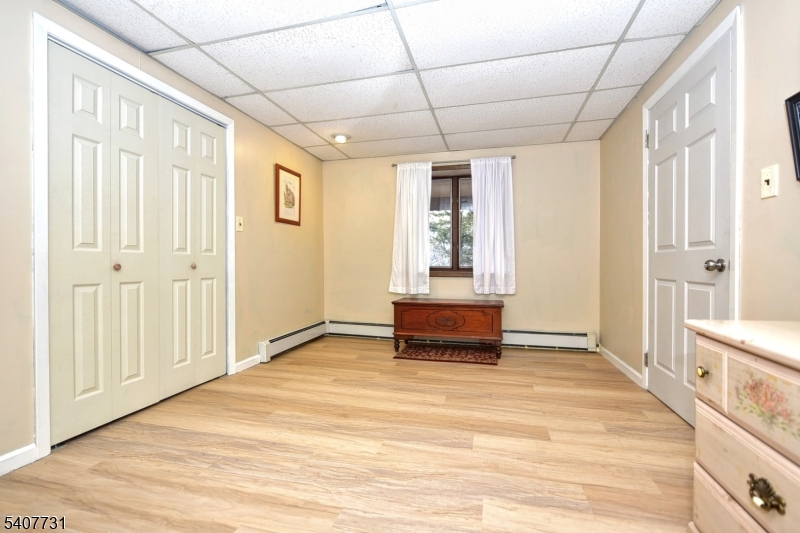 7 Birch Road Bloomingdale, NJ 07403 - Photo 37 of 45 a view of empty room with wooden floor and fan