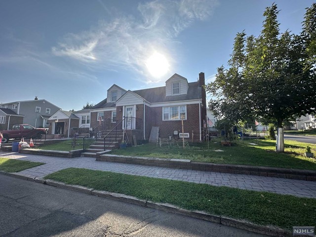 440 Collins Avenue Hasbrouck Heights, NJ 07604 - Photo 1 of 13 a city street lined with tall buildings and trees