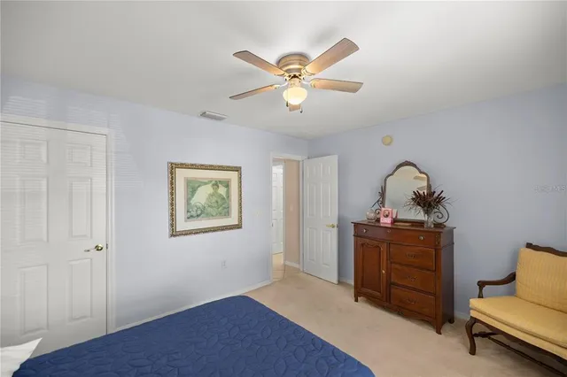 a view of workspace with wooden floor and ceiling fan