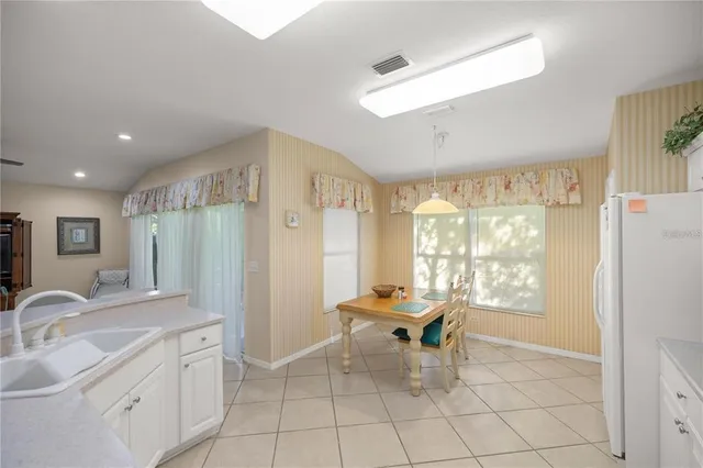 a living room with furniture a large window and a shower