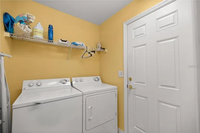 a utility room with dryer and washer
