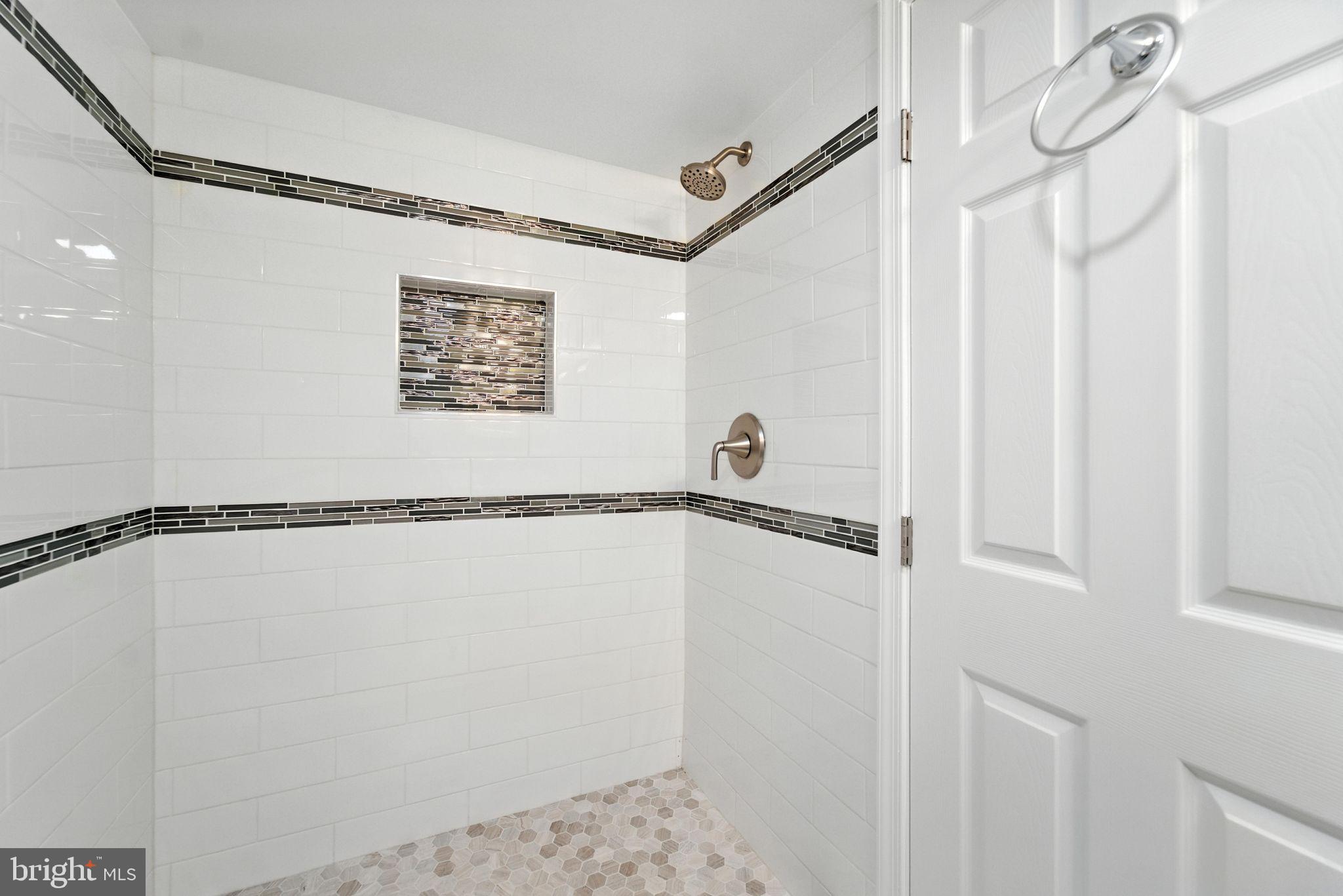 1608 Howard Avenue Baltimore, MD 21221 - Photo 14 of 31 BATHROOM 2 WITH CUSTOM TILE SHOWER