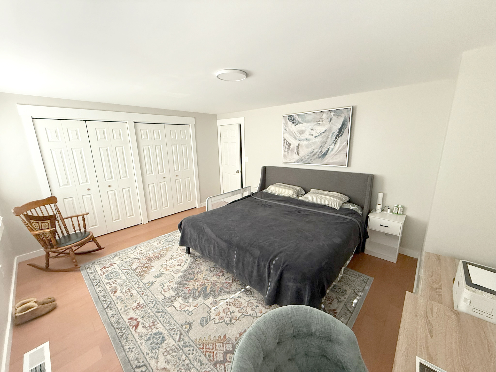 45 Mattabasset Drive, Unit 45 Meriden, CT 06450 - Photo 19 of 40 a bedroom with a bed and wooden floor