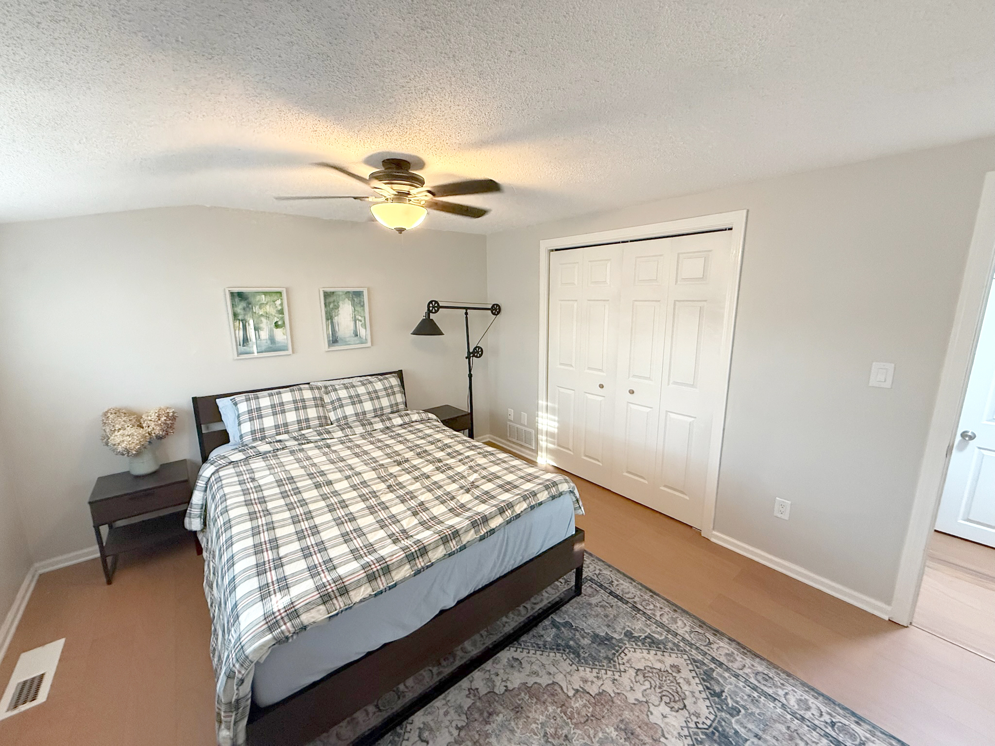 45 Mattabasset Drive, Unit 45 Meriden, CT 06450 - Photo 28 of 40 a bedroom with a bed and a chandelier