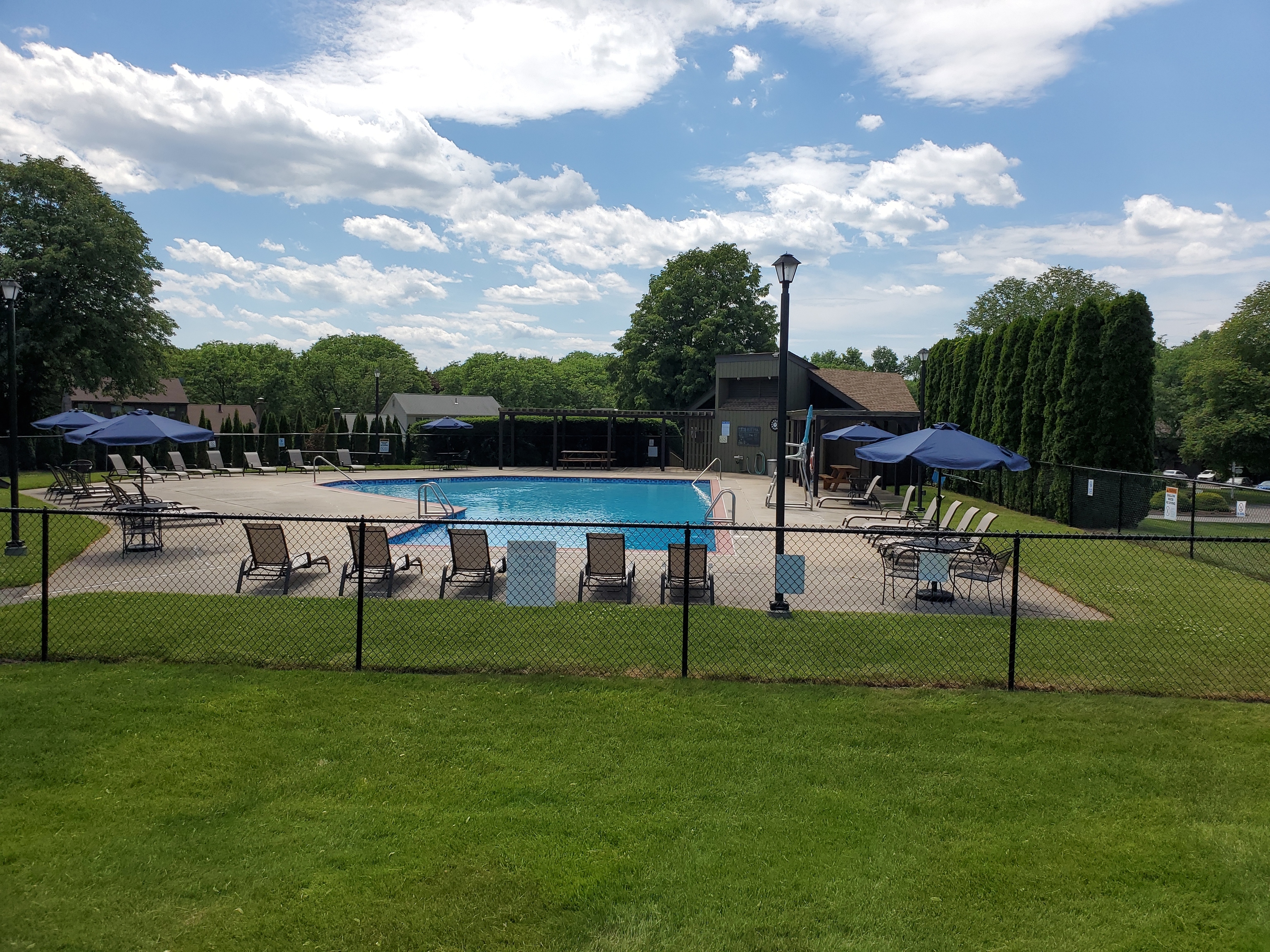 45 Mattabasset Drive, Unit 45 Meriden, CT 06450 - Photo 38 of 40 a view of a lake with a table and chairs