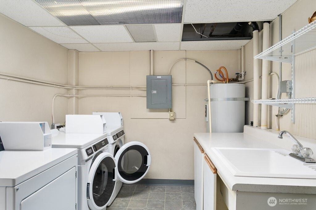 4831 Fauntleroy Way Southwest, Unit 206 Seattle, WA 98116 - Photo 16 of 21 a utility room with dryer and washer
