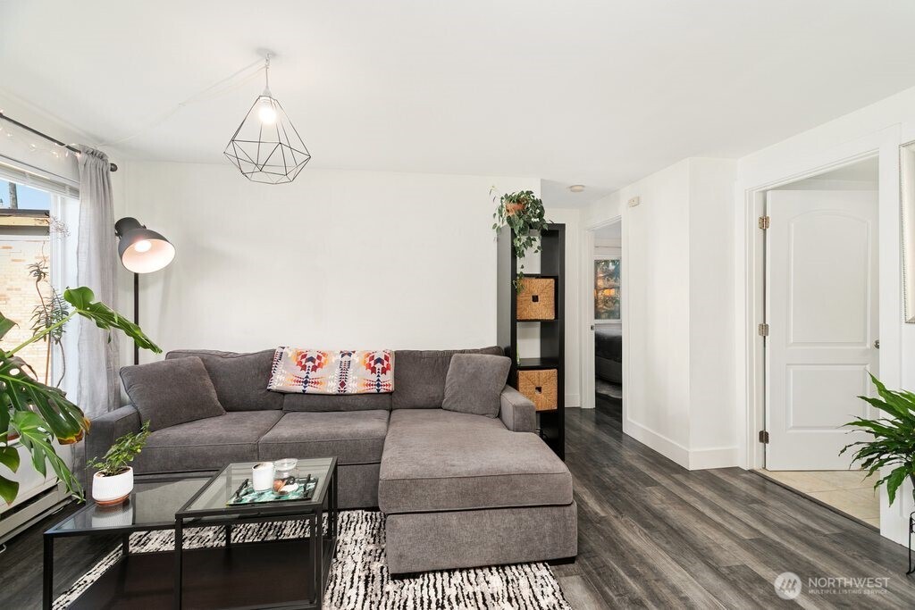 4831 Fauntleroy Way Southwest, Unit 206 Seattle, WA 98116 - Photo 8 of 21 a living room with furniture and wooden floor